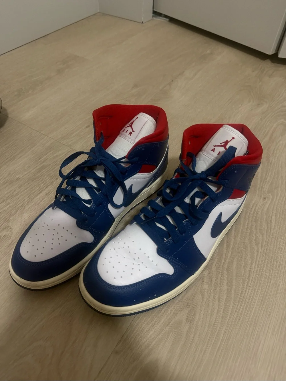 Jordan 1 Mid 'Patriots' sneakers in blue, white, and red